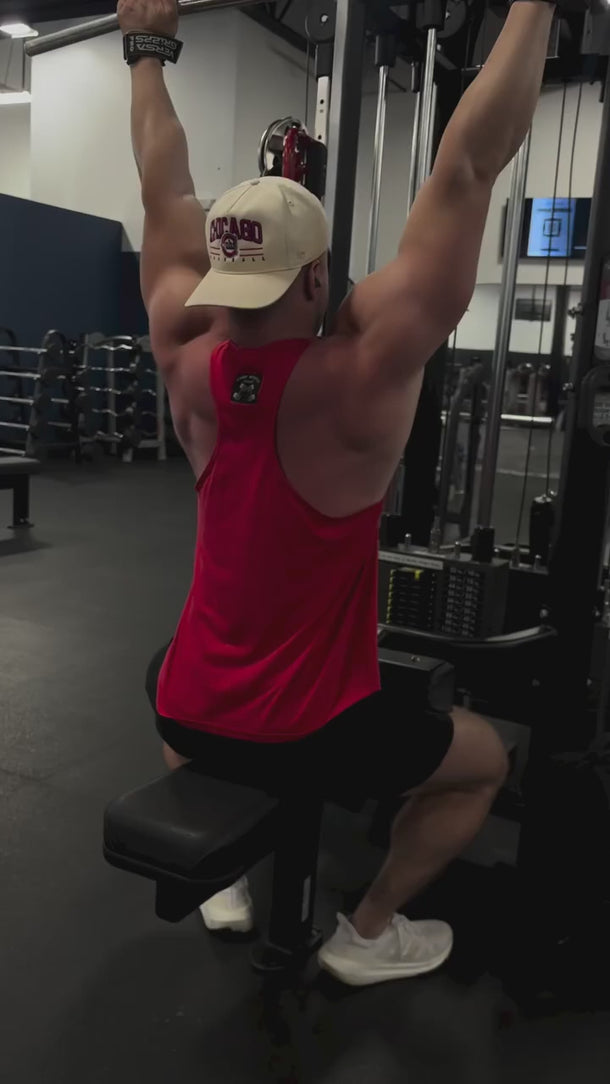 Camp Muscle athlete training in Performance Tank Red